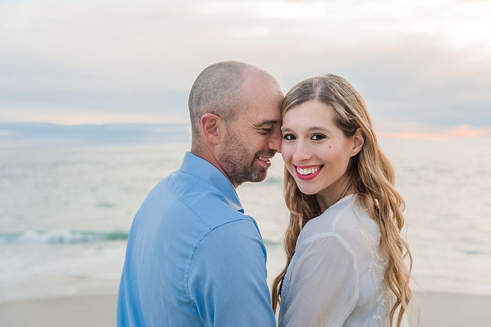 couple posing on beach san diego engagement photos