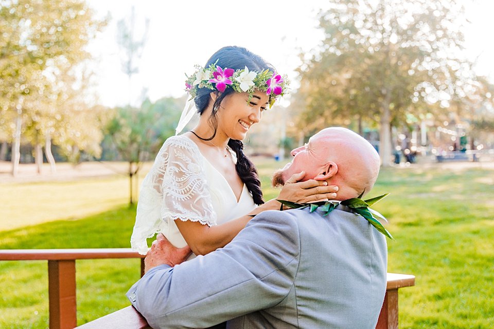 bride cupping groom's face in her hands park wedding venues San Diego