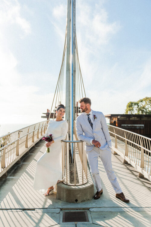 bride and groom looking at each other scripps pedestrian bridge La Jolla