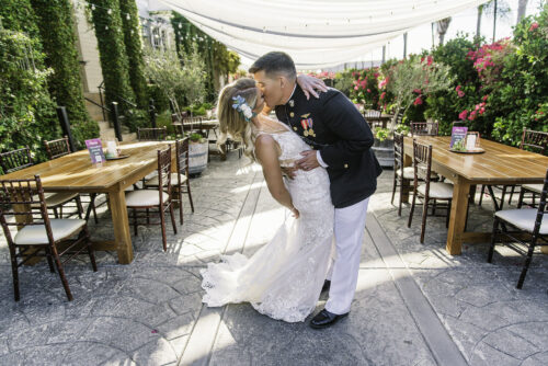 groom in Marine attire dipping bride Cuvier Club La Jolla CA