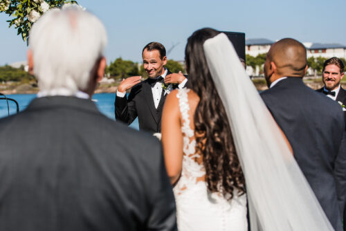 groom sees bride for the first time walking down aisle