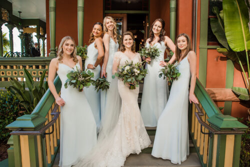 bridesmaid group photo on stairs at britt scripps manor wedding venue