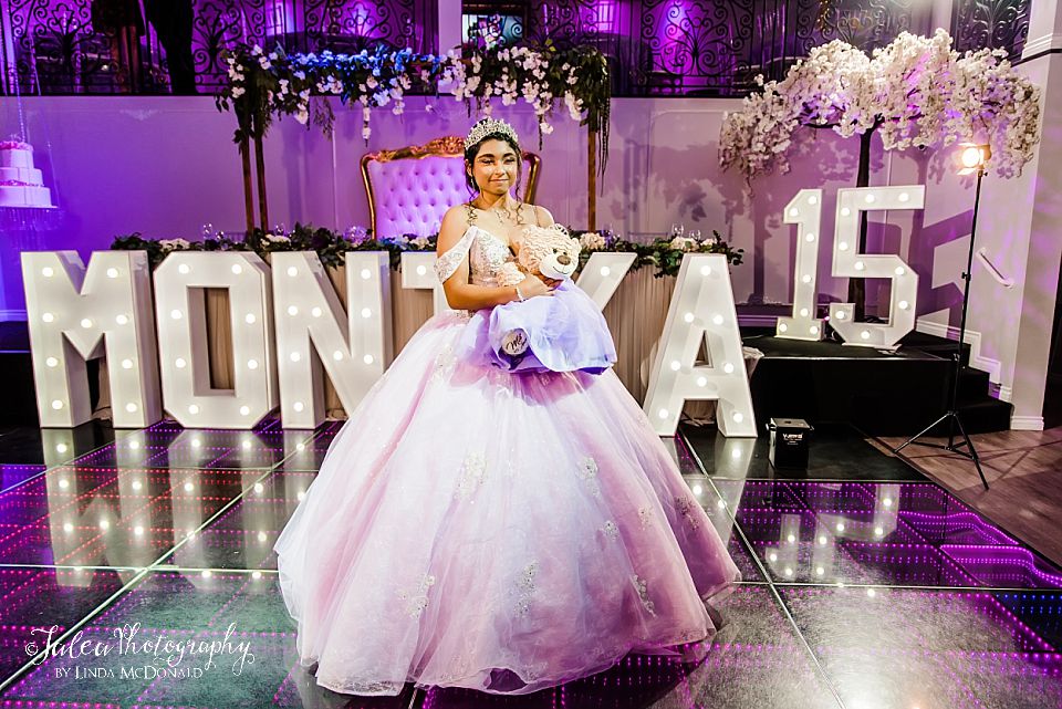 young girl standing with last doll at vogue hall chula vista quinceanera traditions