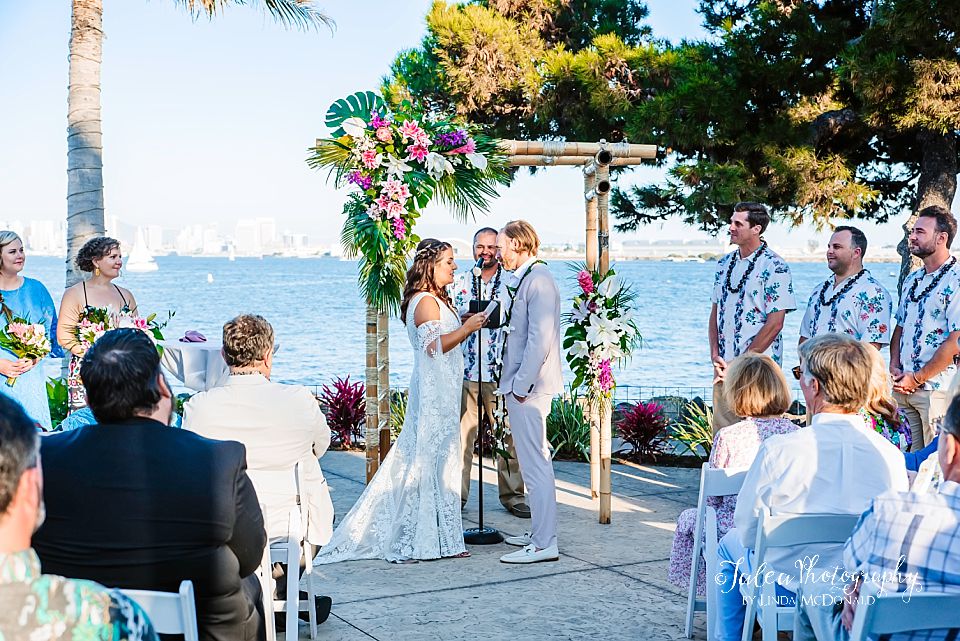 couple reciting their vows in the San Diego harbor at Bali Hai Restaurant 