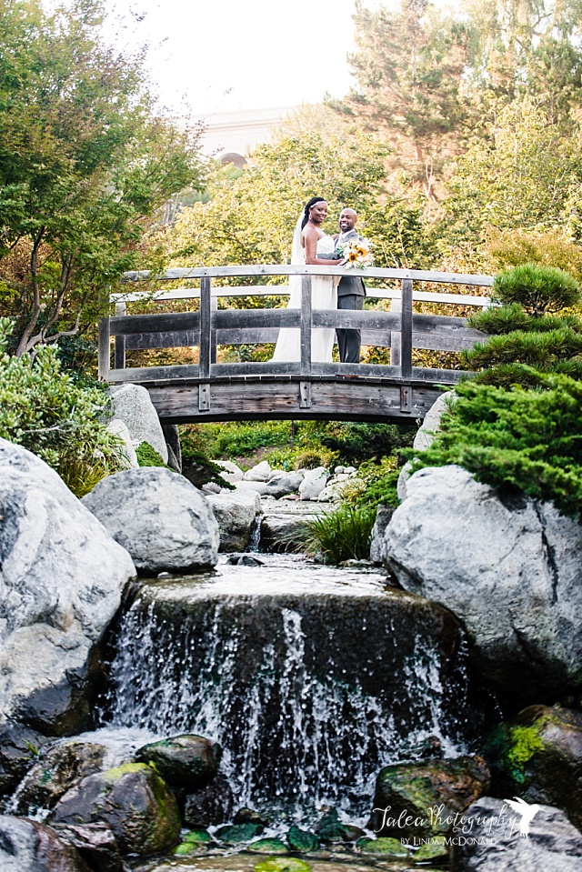 African American couple posing on a bridge at Japanese Friendship Garden wedding Balboa Park 